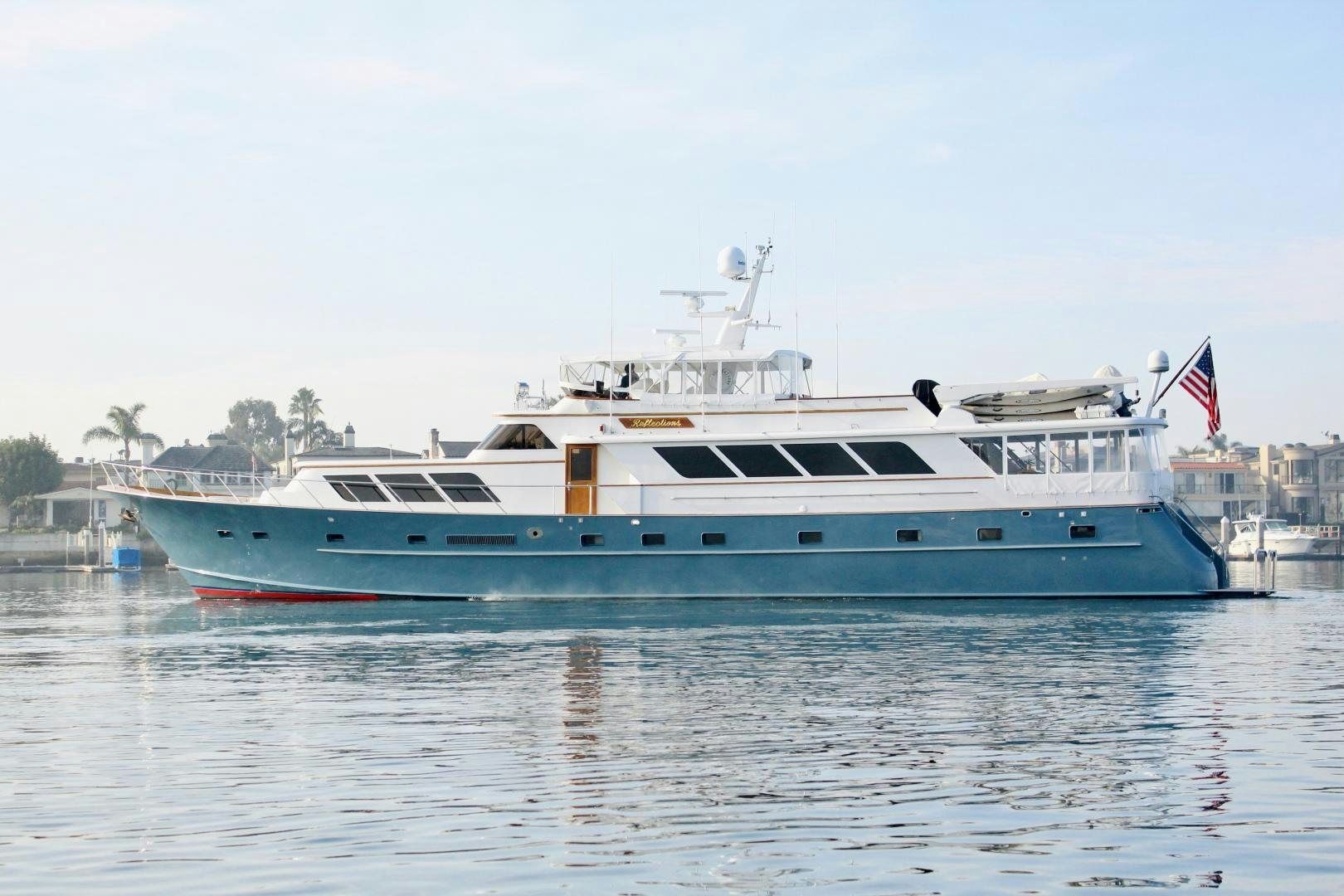 a large boat on the water aboard REFLECTIONS Yacht for Sale