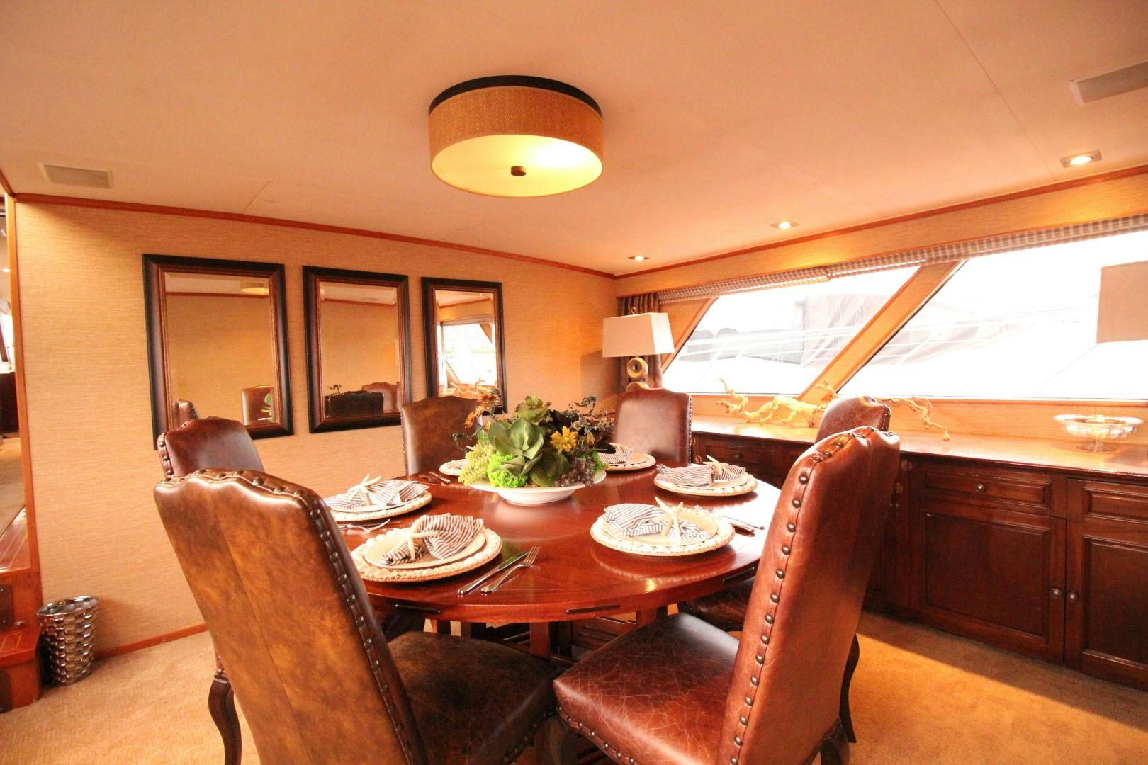 a dining room with a table and chairs aboard REFLECTIONS Yacht for Sale