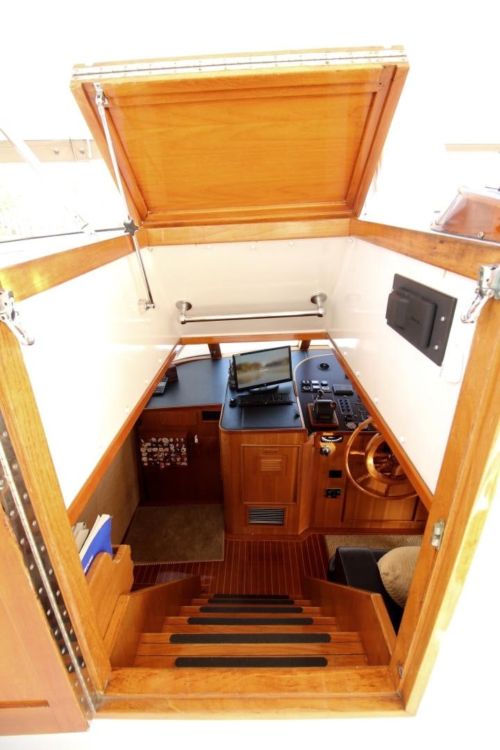a wooden staircase with a wood door aboard REFLECTIONS Yacht for Sale