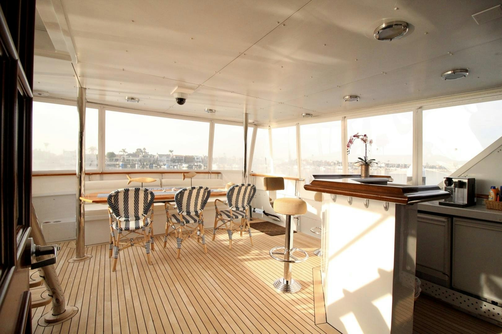 a kitchen with a table and chairs aboard REFLECTIONS Yacht for Sale