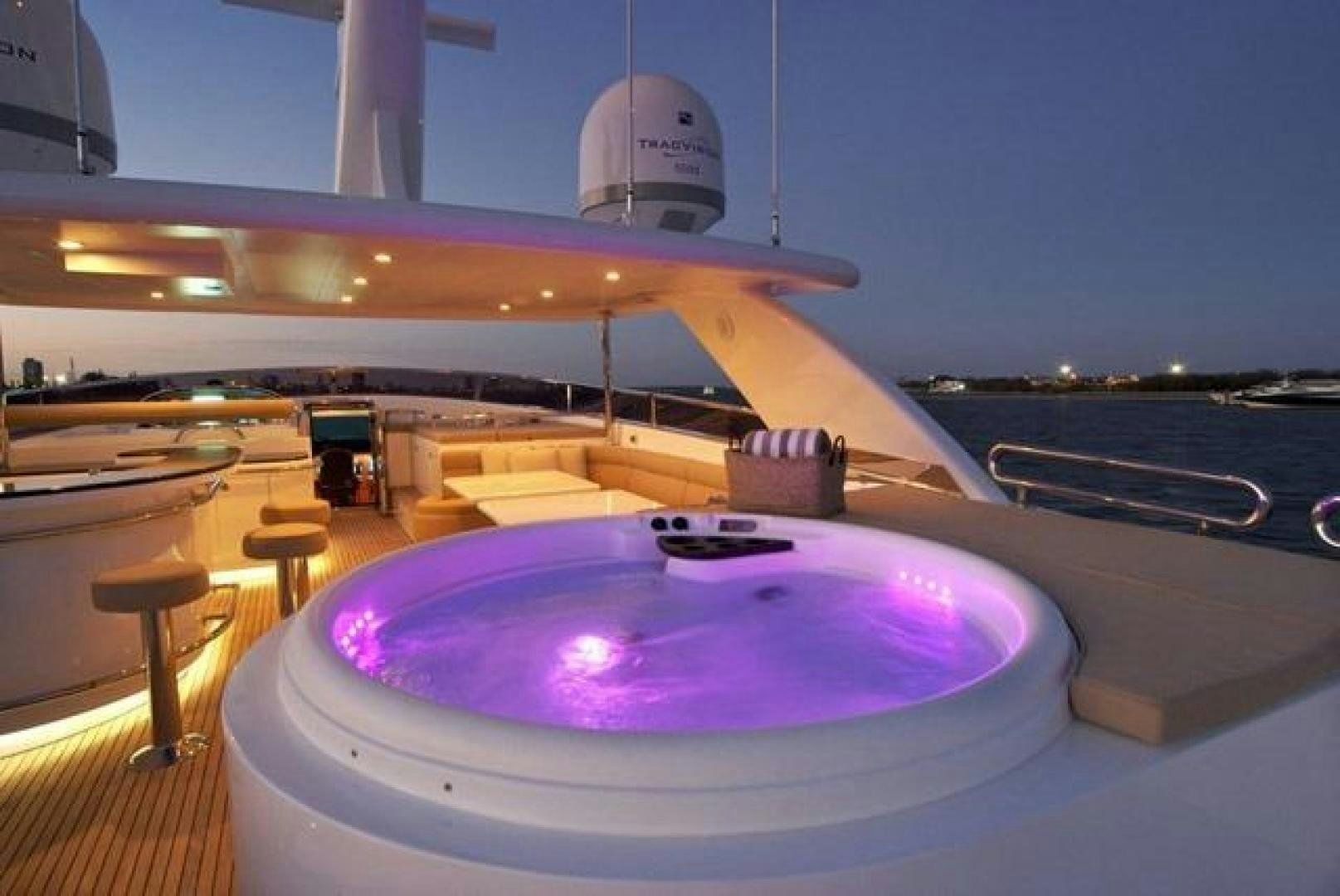 a large pool table with a purple round table and a white dome on top aboard ENCORE Yacht for Sale