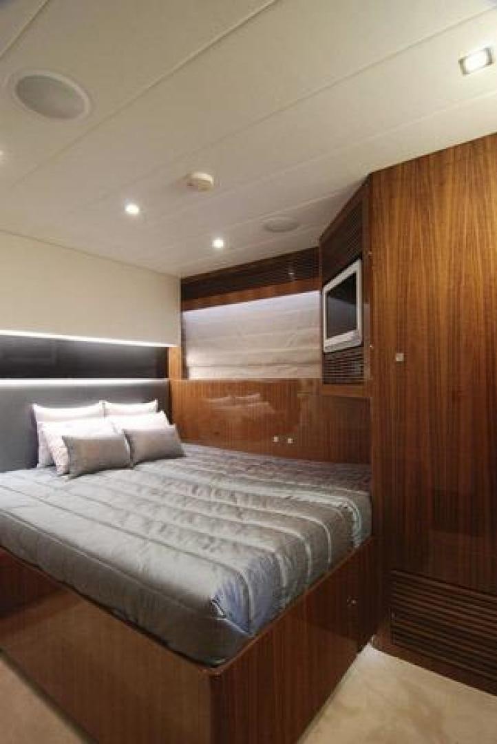 a bed in a room aboard ENCORE Yacht for Sale