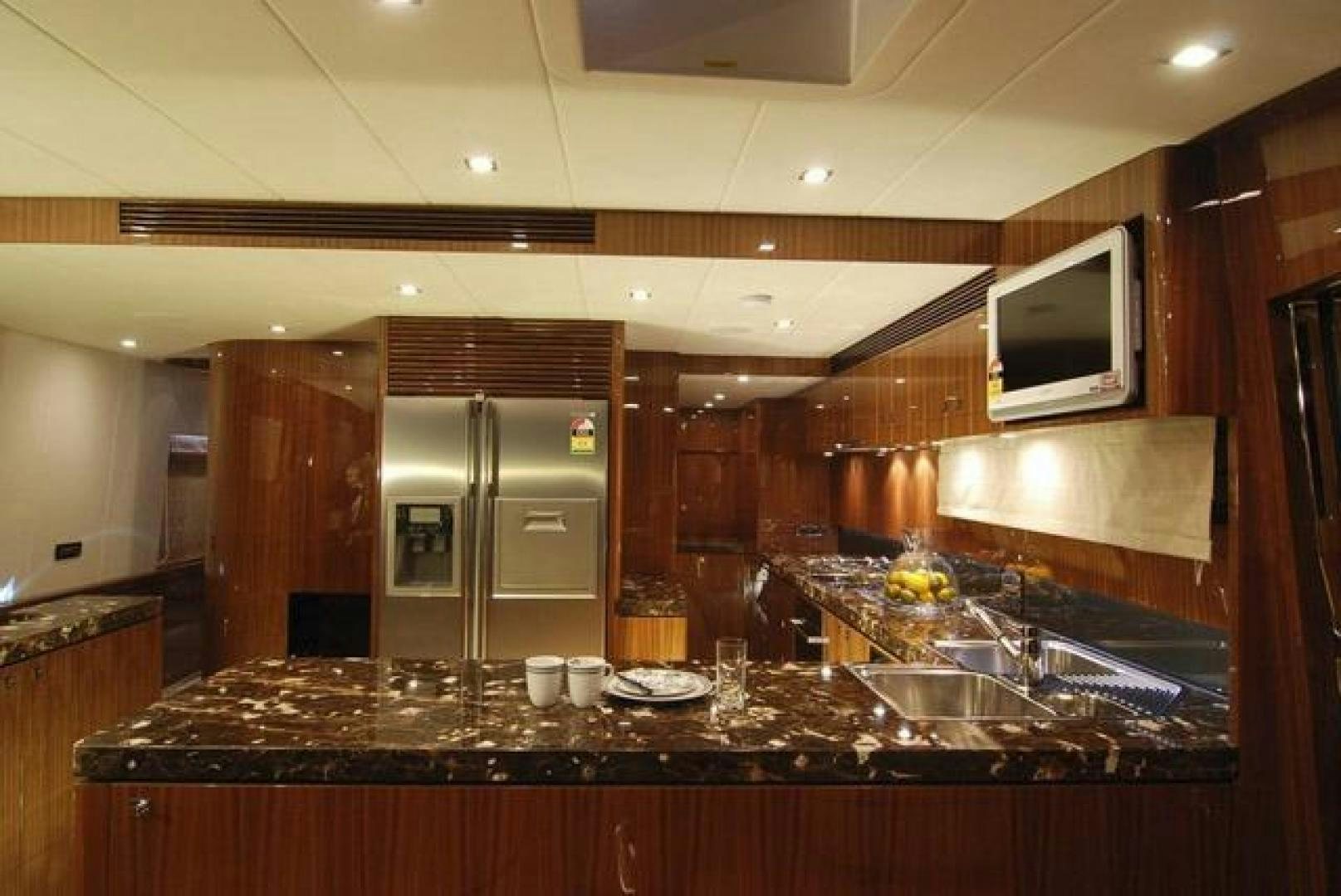 a kitchen with a large island aboard ENCORE Yacht for Sale