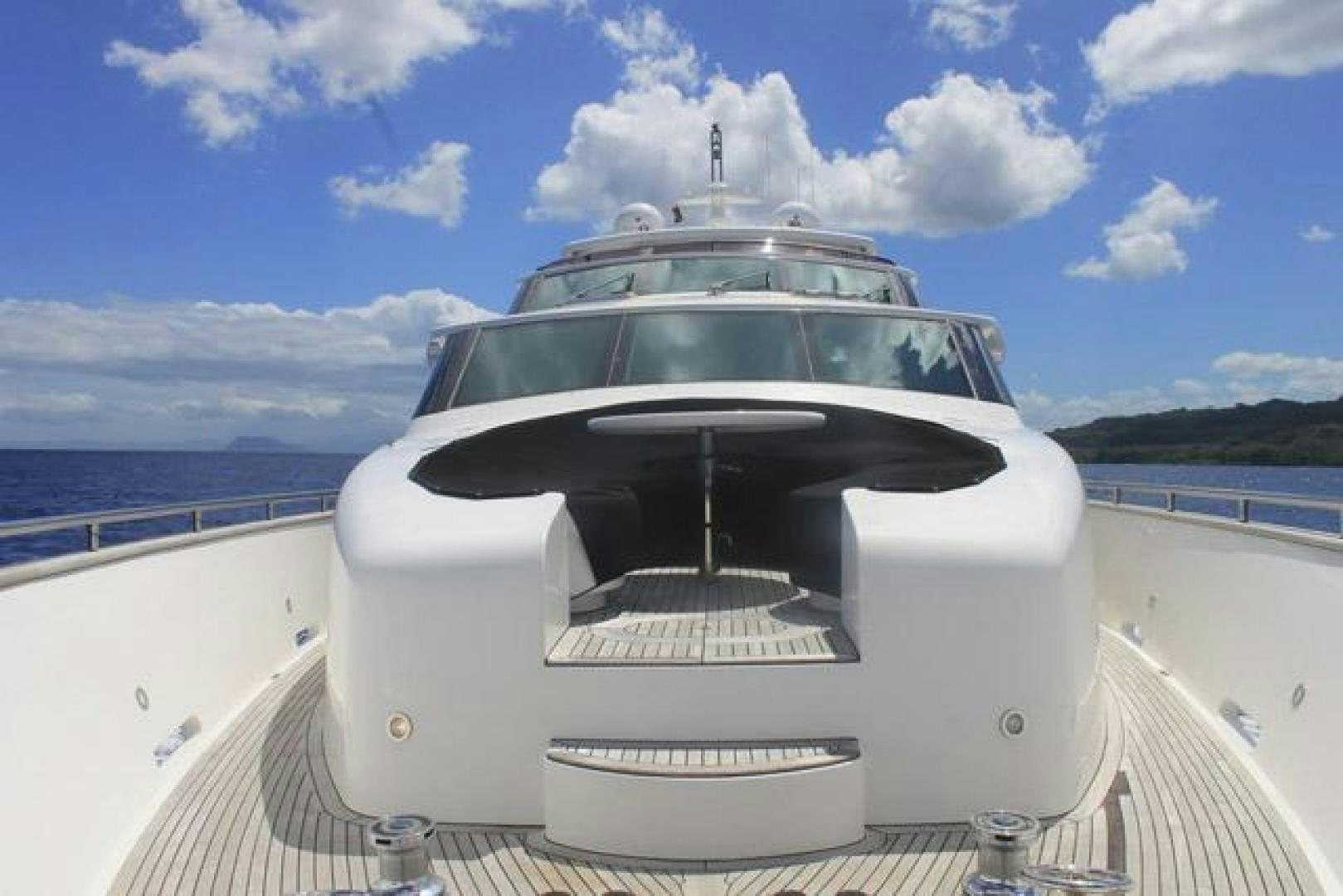 a white boat on a body of water aboard ENCORE Yacht for Sale