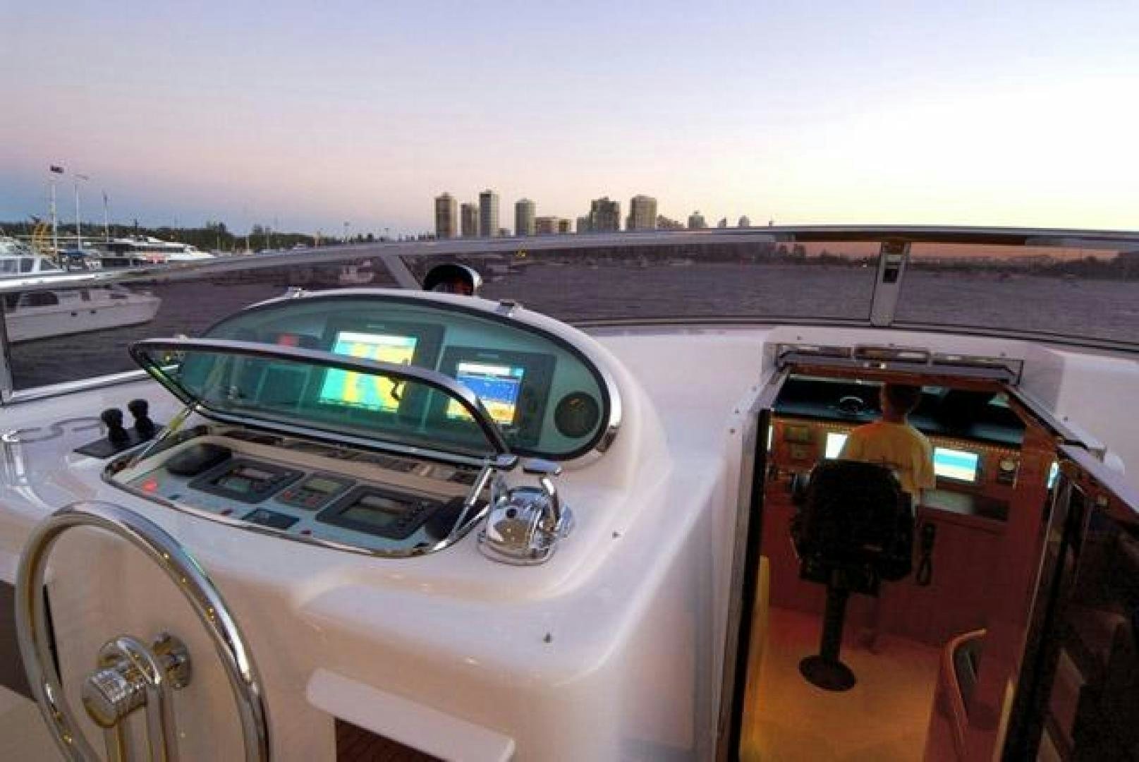 a car with a green light on the hood aboard ENCORE Yacht for Sale