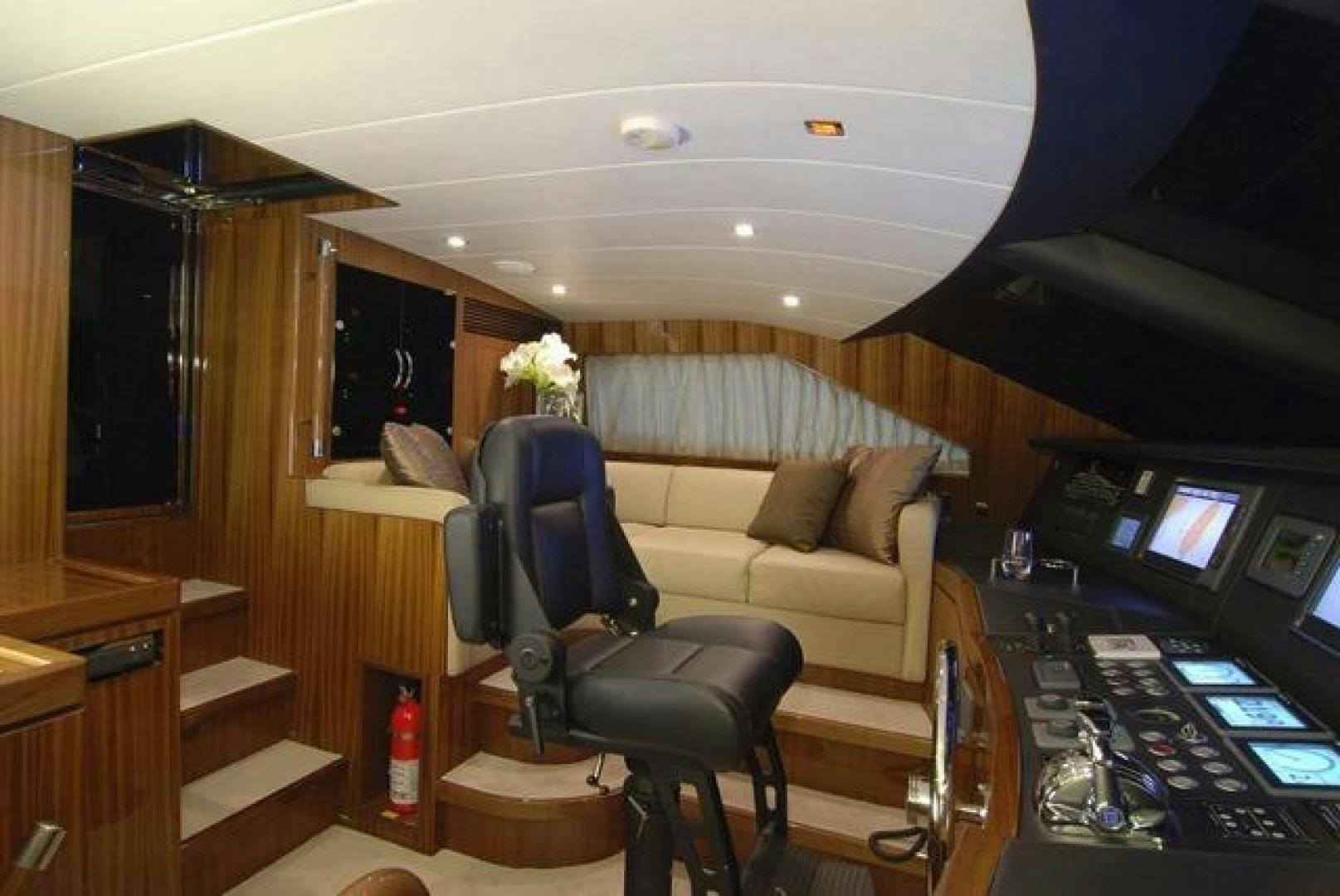 a room with a couch and a chair aboard ENCORE Yacht for Sale