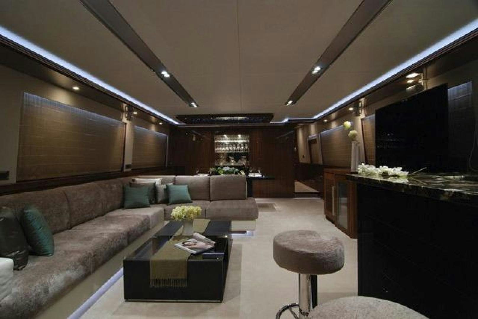 a living room with a couch and a coffee table aboard ENCORE Yacht for Sale