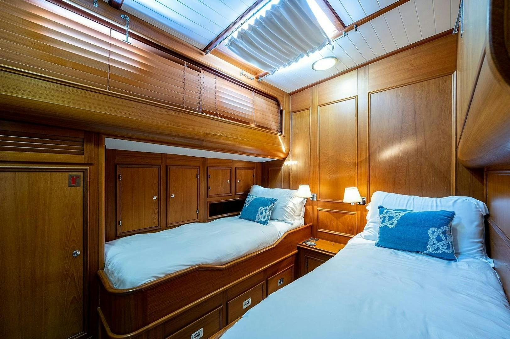 a room with two beds aboard ATALI Yacht for Sale