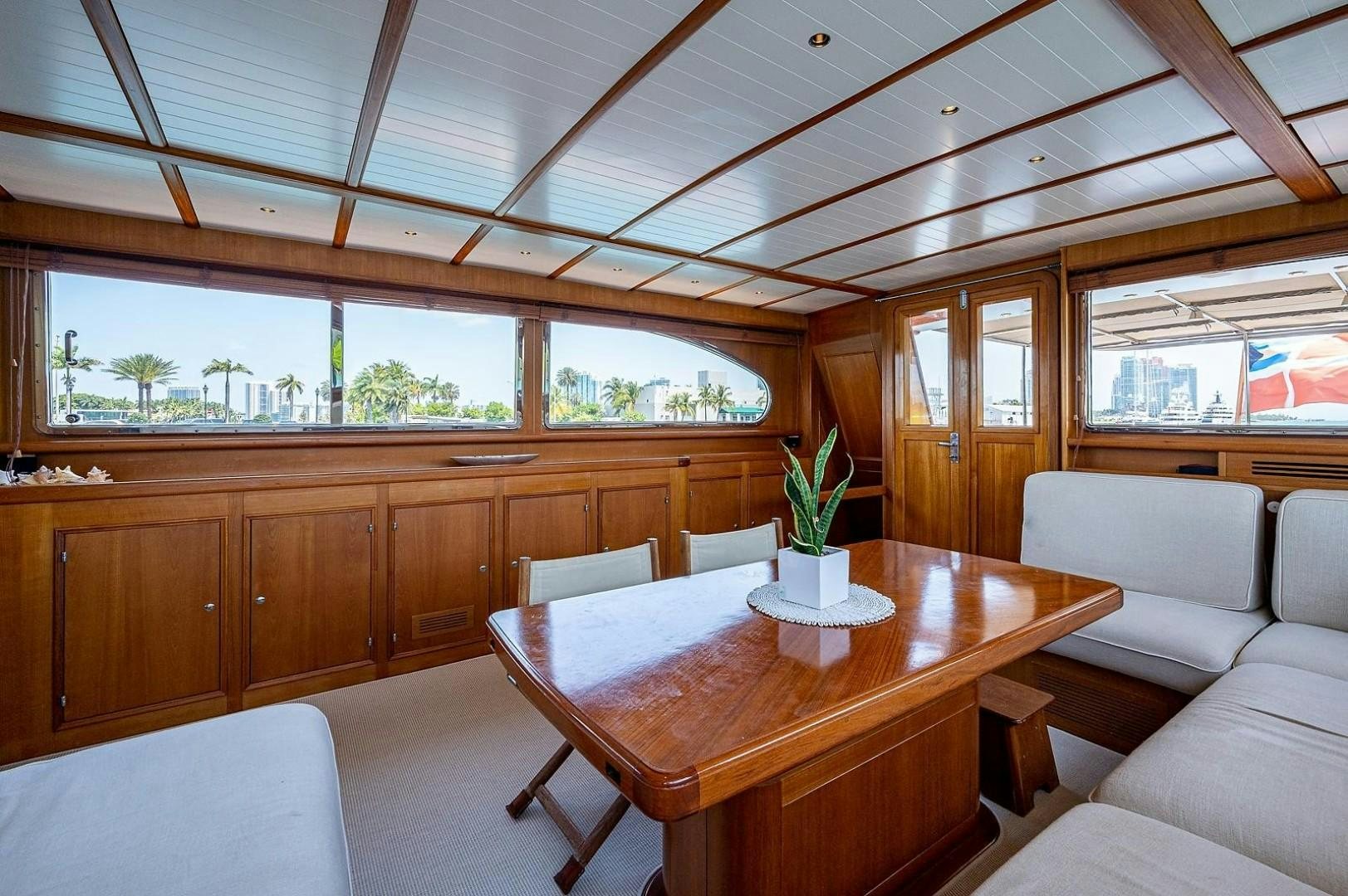 a room with a table and chairs aboard ATALI Yacht for Sale