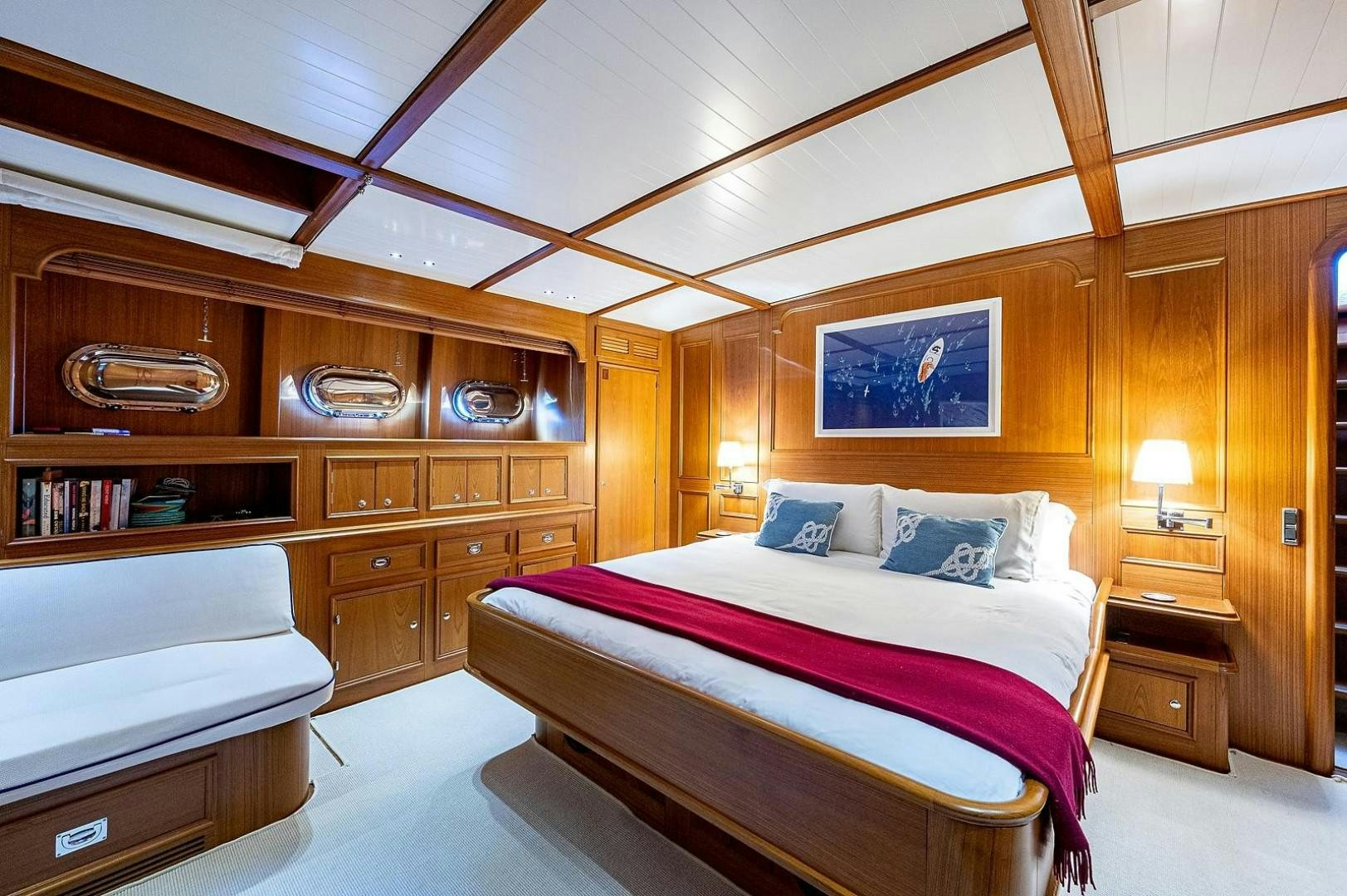 a bedroom with a bed and a shelf aboard ATALI Yacht for Sale