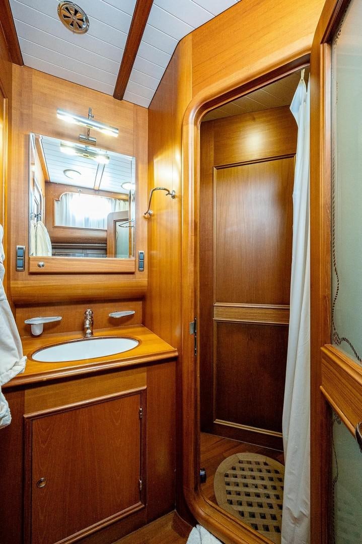 a bathroom with a sink and a mirror aboard ATALI Yacht for Sale