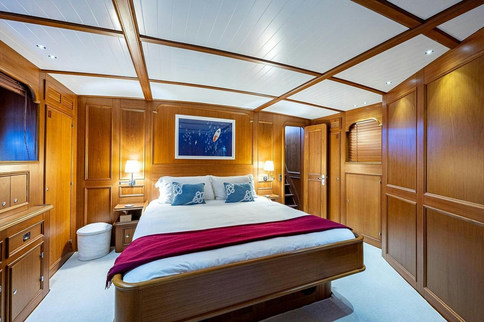 a large bed in a room aboard ATALI Yacht for Sale