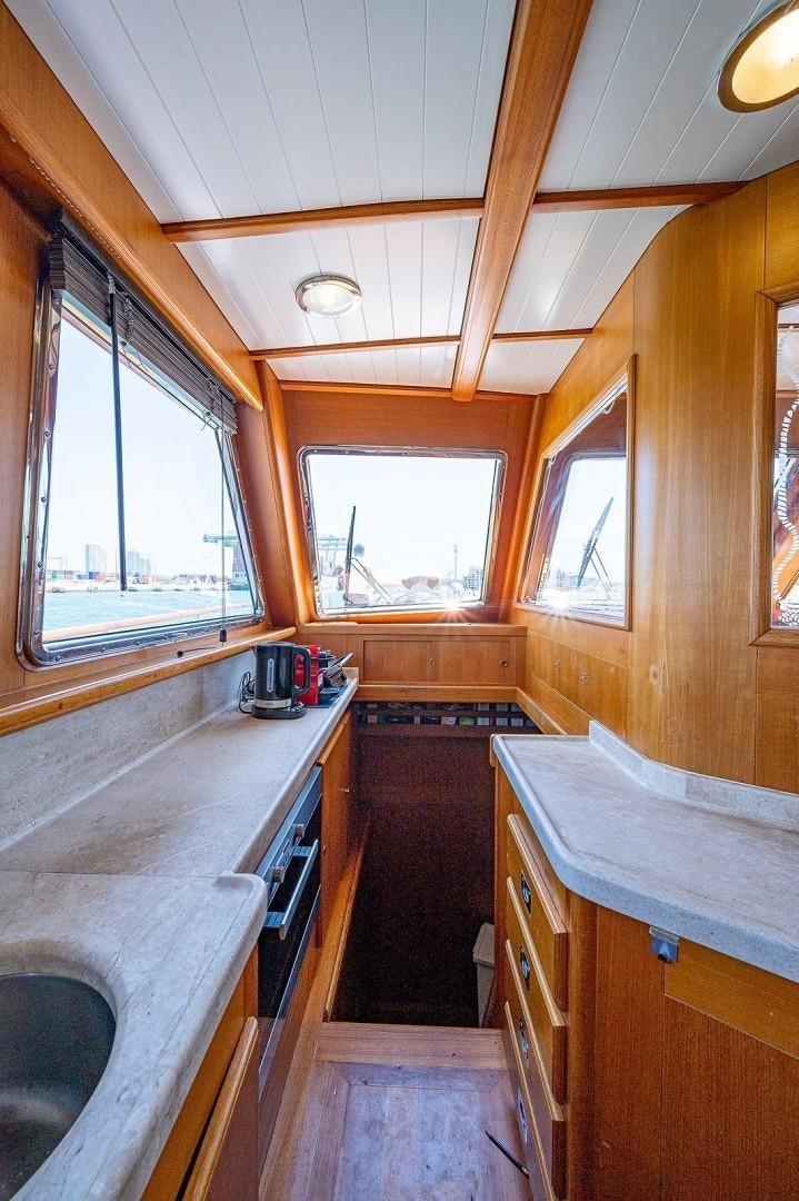 a kitchen with a sink and a window aboard ATALI Yacht for Sale
