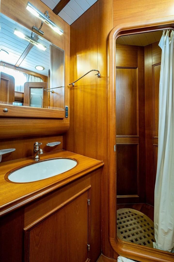 a bathroom with a sink and a shower aboard ATALI Yacht for Sale