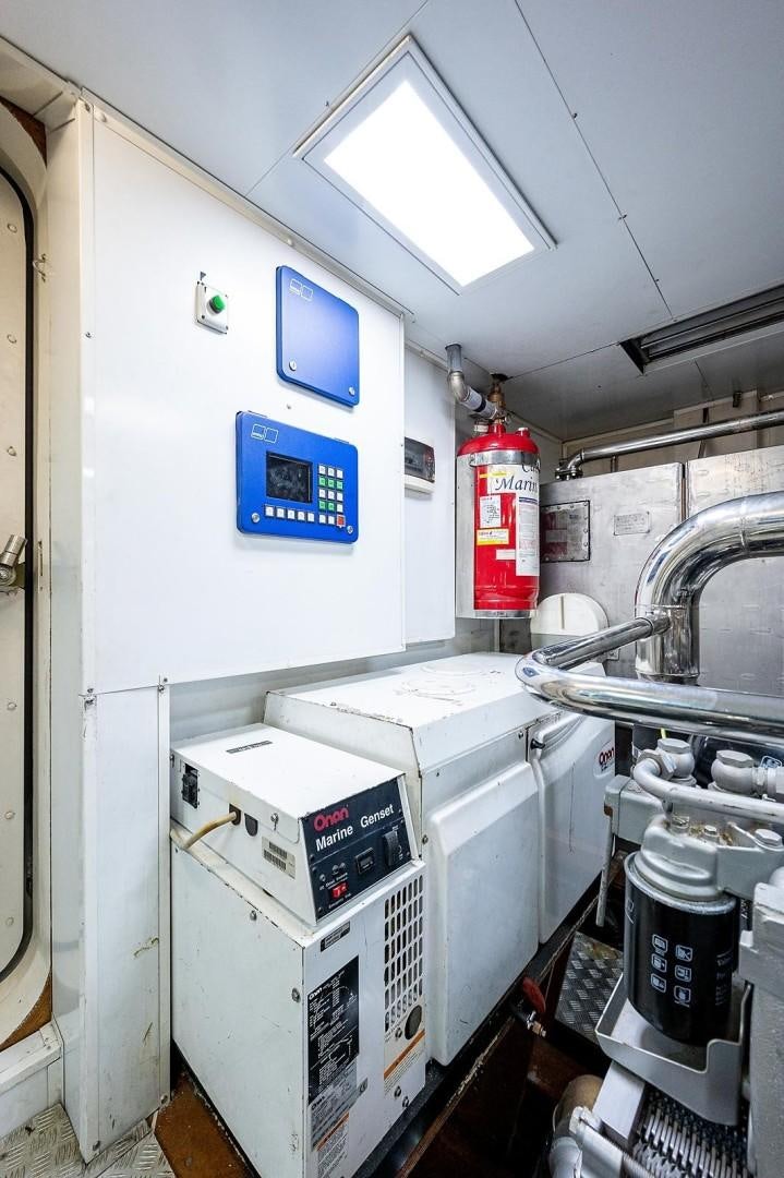 a machine in a room with Rietveld Schröder House in the background aboard ATALI Yacht for Sale