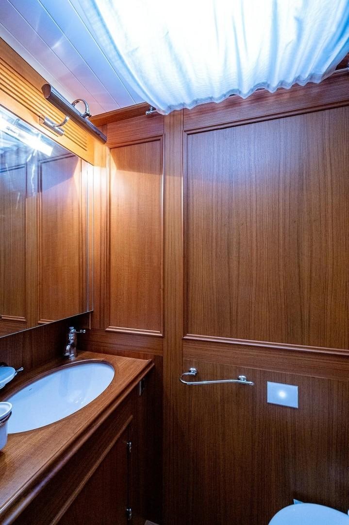 a bathroom with a sink and a mirror aboard ATALI Yacht for Sale