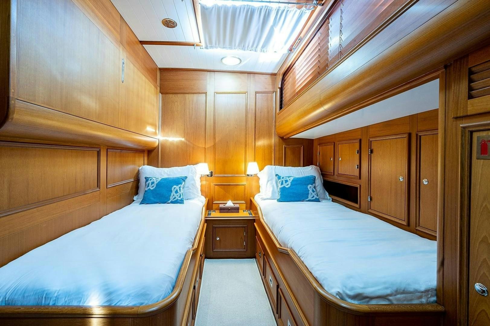 a couple of beds in a room aboard ATALI Yacht for Sale