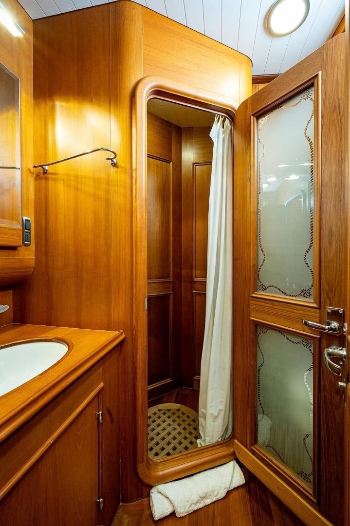 a bathroom with a shower and sink aboard ATALI Yacht for Sale