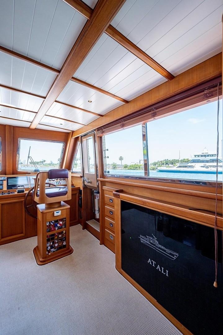 a room with a desk and a chair aboard ATALI Yacht for Sale