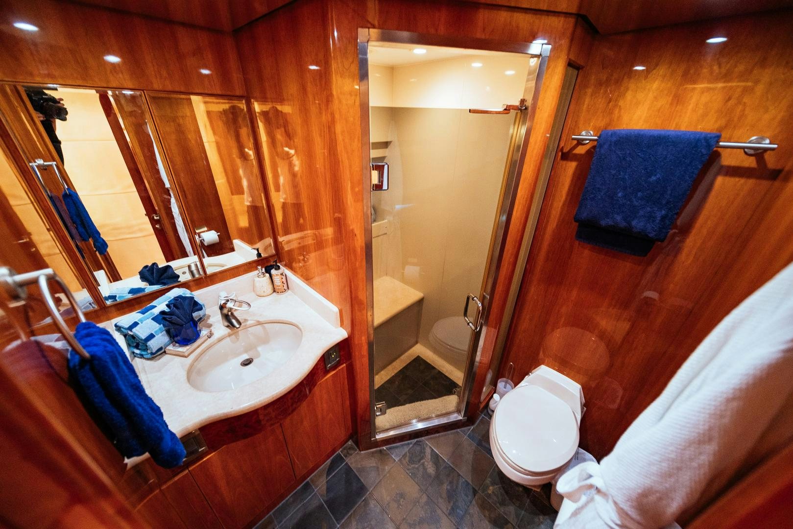 a bathroom with a sink and a mirror aboard ANDIAMO Yacht for Sale