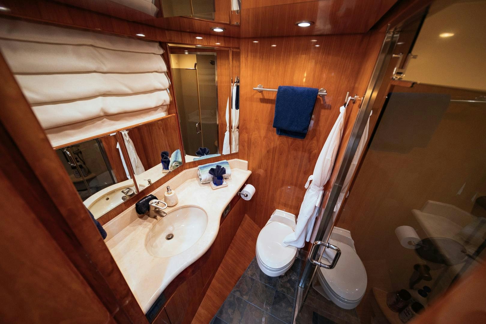 a bathroom with a sink and a toilet aboard ANDIAMO Yacht for Sale