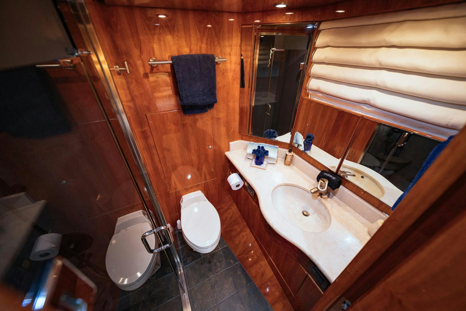 a bathroom with a standup shower aboard ANDIAMO Yacht for Sale