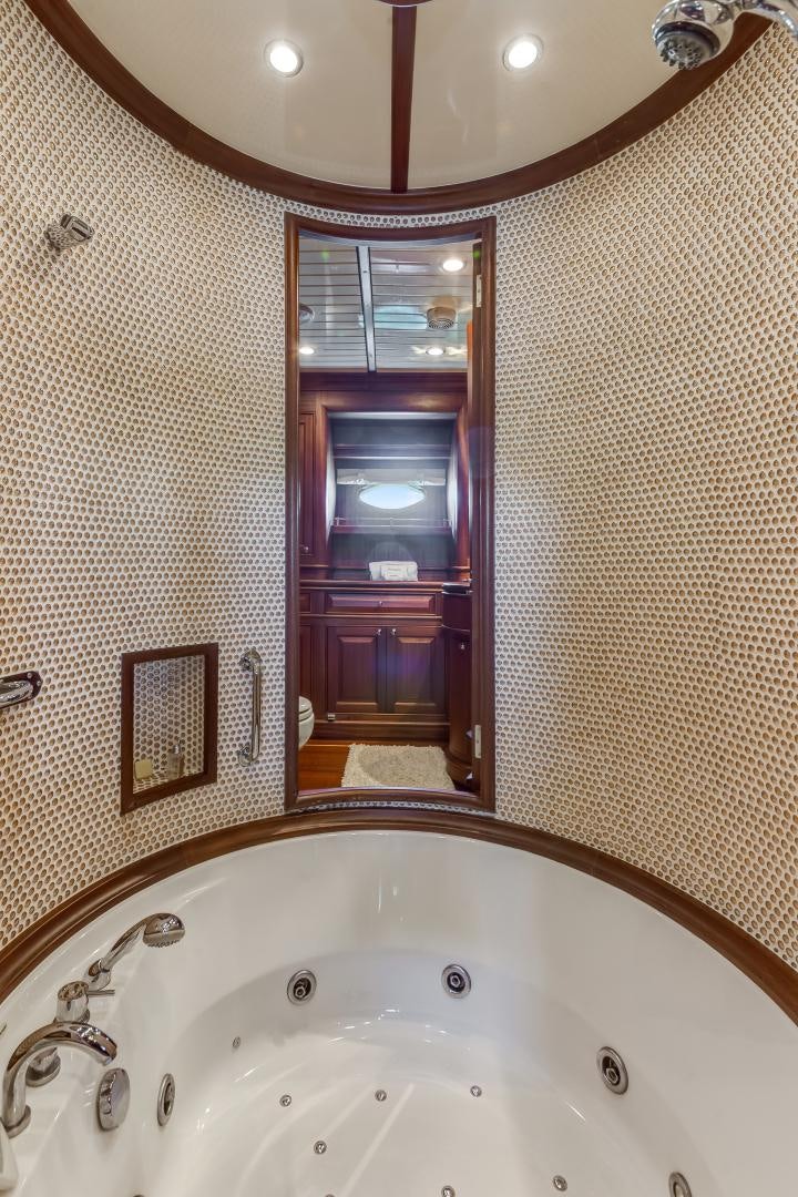 a bathroom with a large bathtub aboard CHANSON II Yacht for Sale
