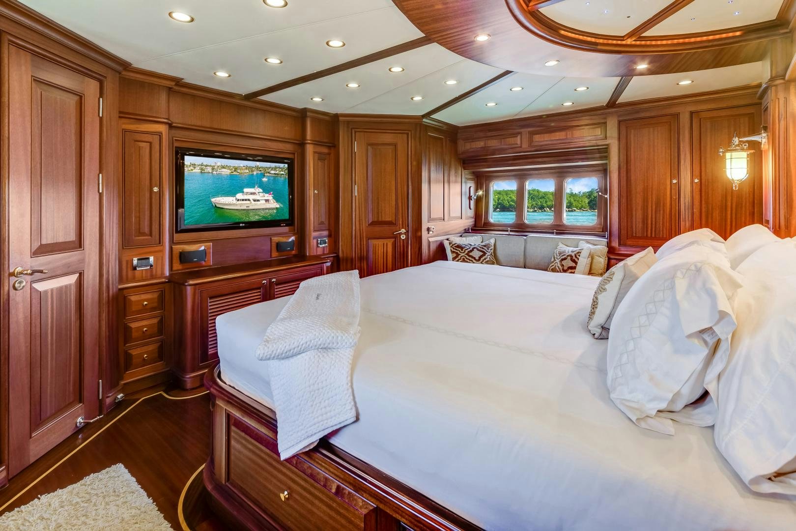 a large bedroom with a large bed aboard CHANSON II Yacht for Sale