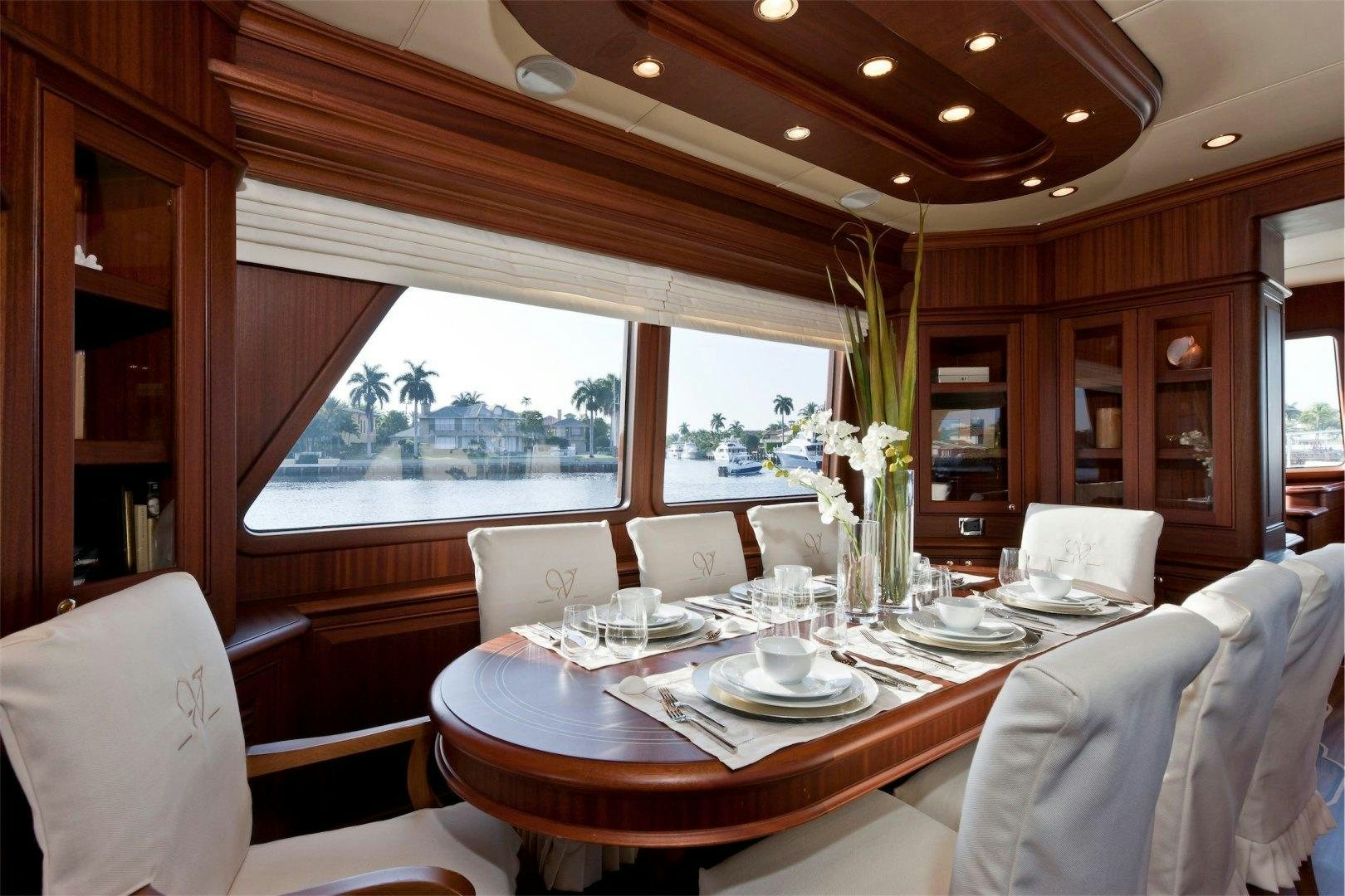 a dining room with a table and chairs aboard NEW VICEM 97 CRUISER Yacht for Sale