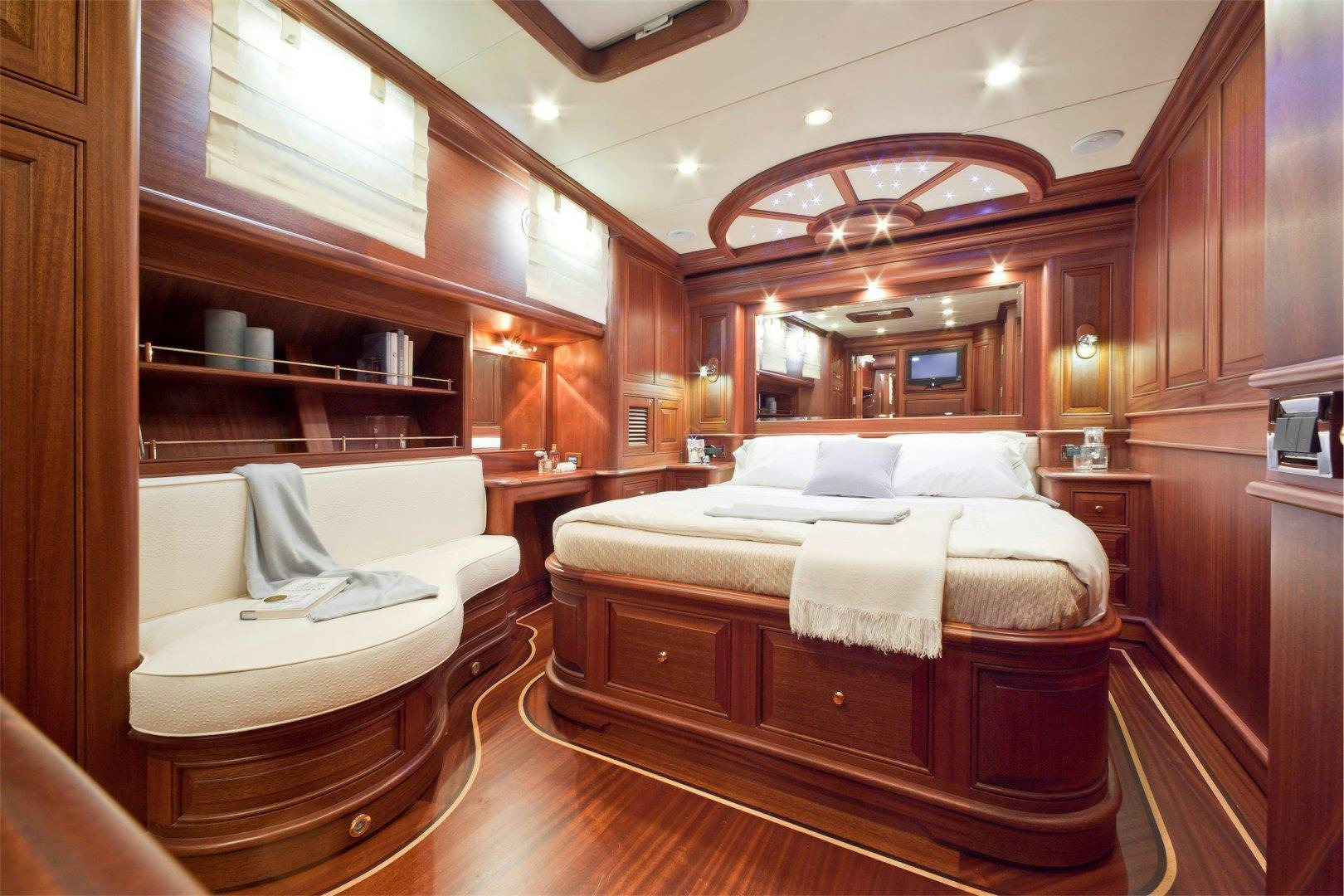 a room with a bed and a mirror aboard NEW VICEM 97 CRUISER Yacht for Sale