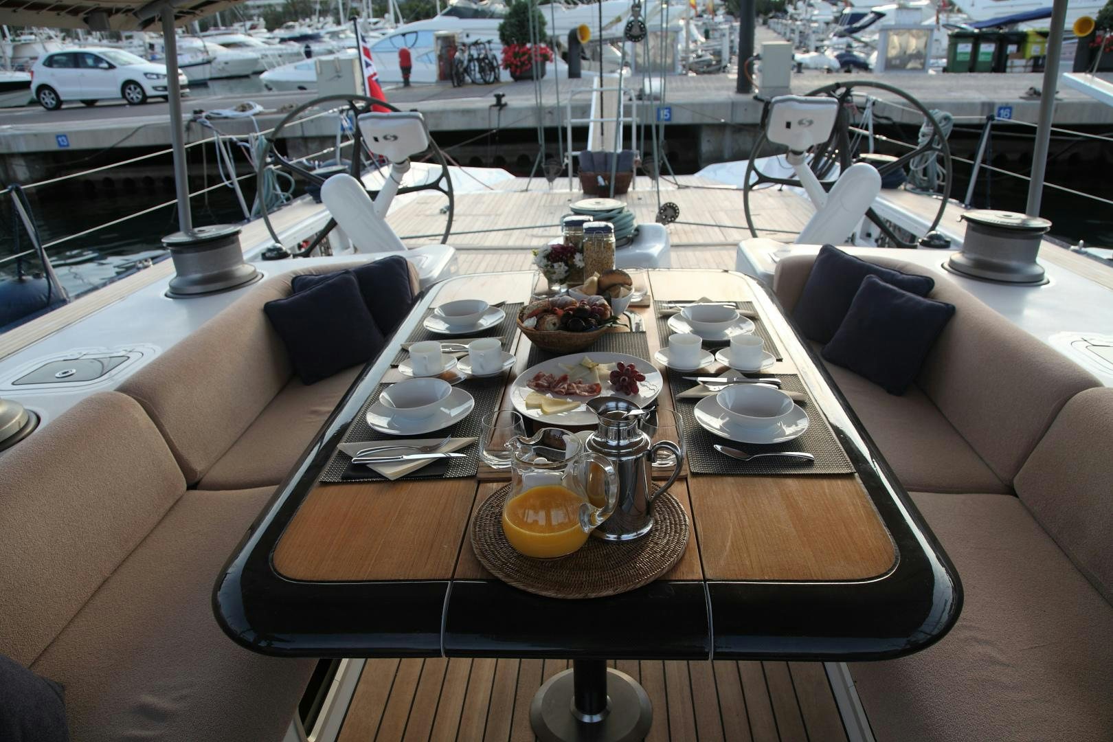 a table with plates and cups on it aboard MARIA ALBA Yacht for Sale