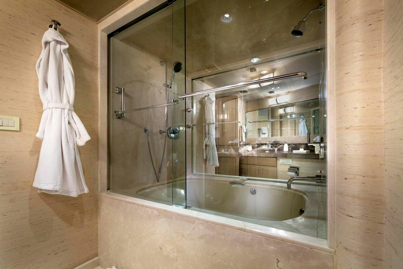 a bathroom with a large mirror aboard CRU Yacht for Sale