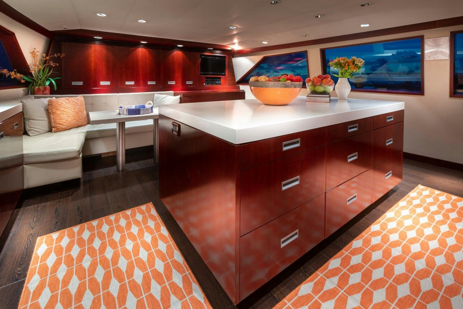 a kitchen with a large island aboard CRU Yacht for Sale