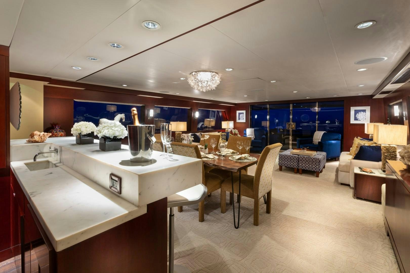 a kitchen with a table and chairs aboard CRU Yacht for Sale