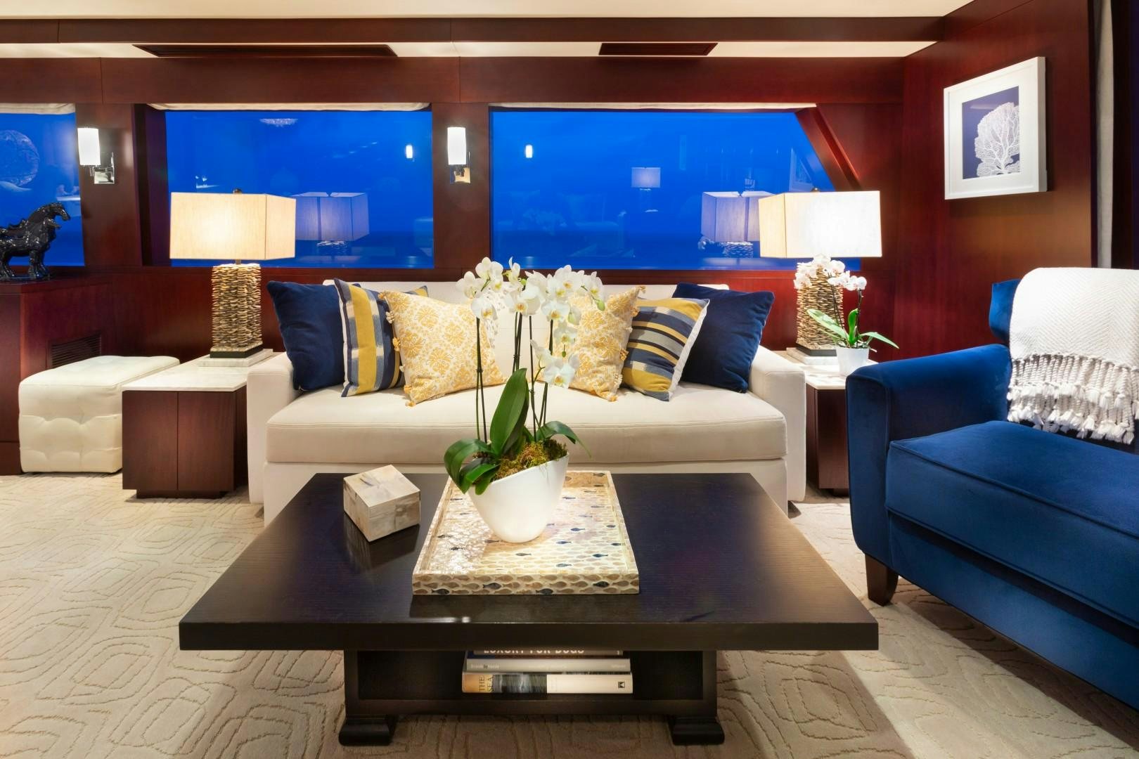 a living room with a couch and a coffee table aboard CRU Yacht for Sale