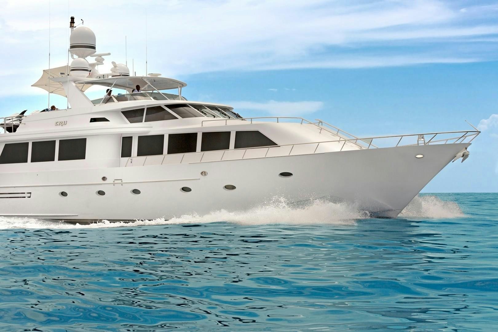 a white yacht in the water aboard CRU Yacht for Sale