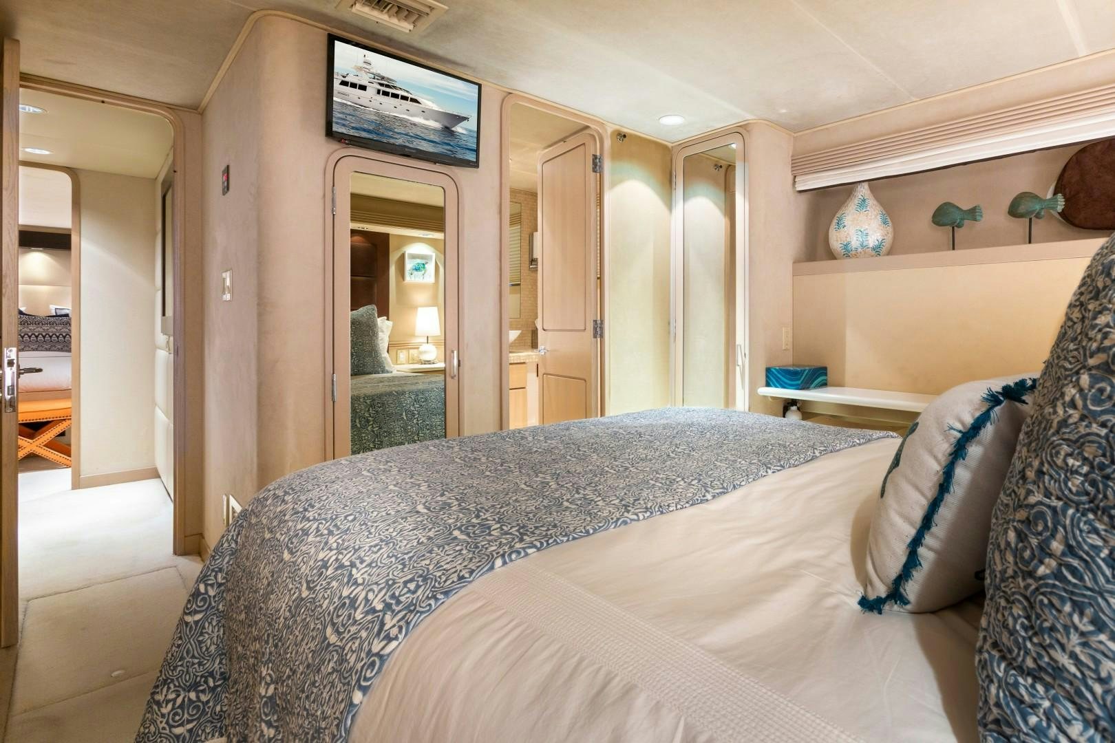 a bed in a room aboard CRU Yacht for Sale