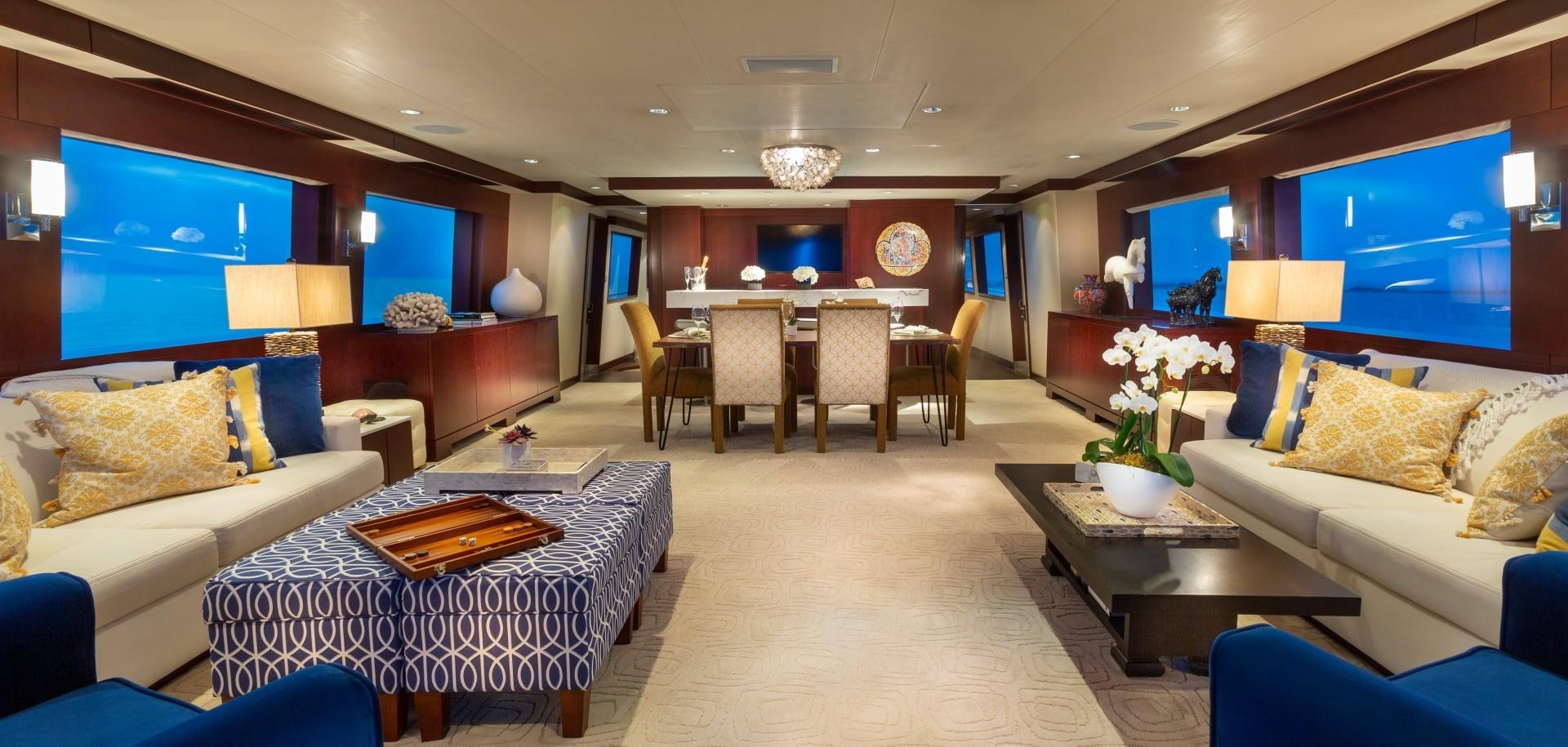 a large living room with a large screen aboard CRU Yacht for Sale