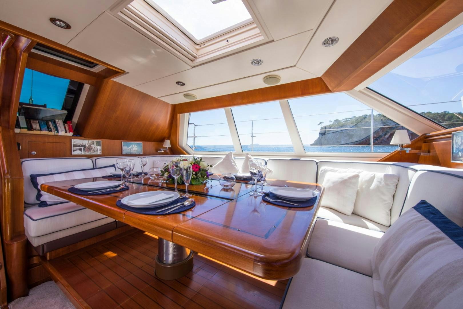 a table with a plate on it aboard ALTA MAREA Yacht for Sale