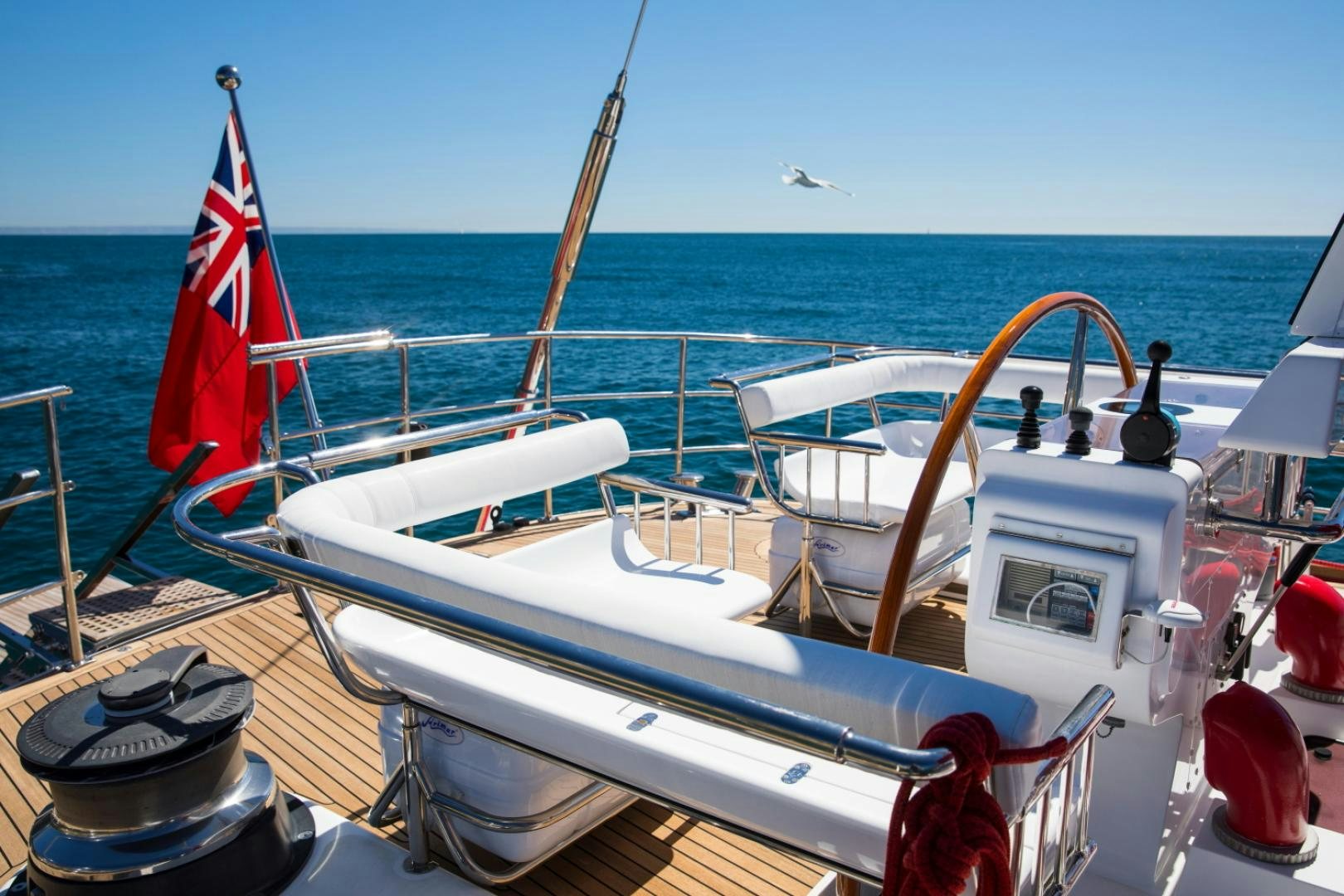 a boat with a flag on the front aboard ALTA MAREA Yacht for Sale