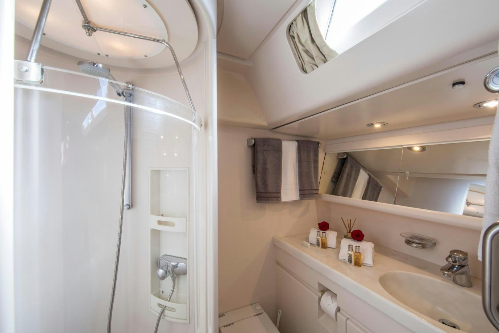 a bathroom with a shower unit and sink aboard ALTA MAREA Yacht for Sale
