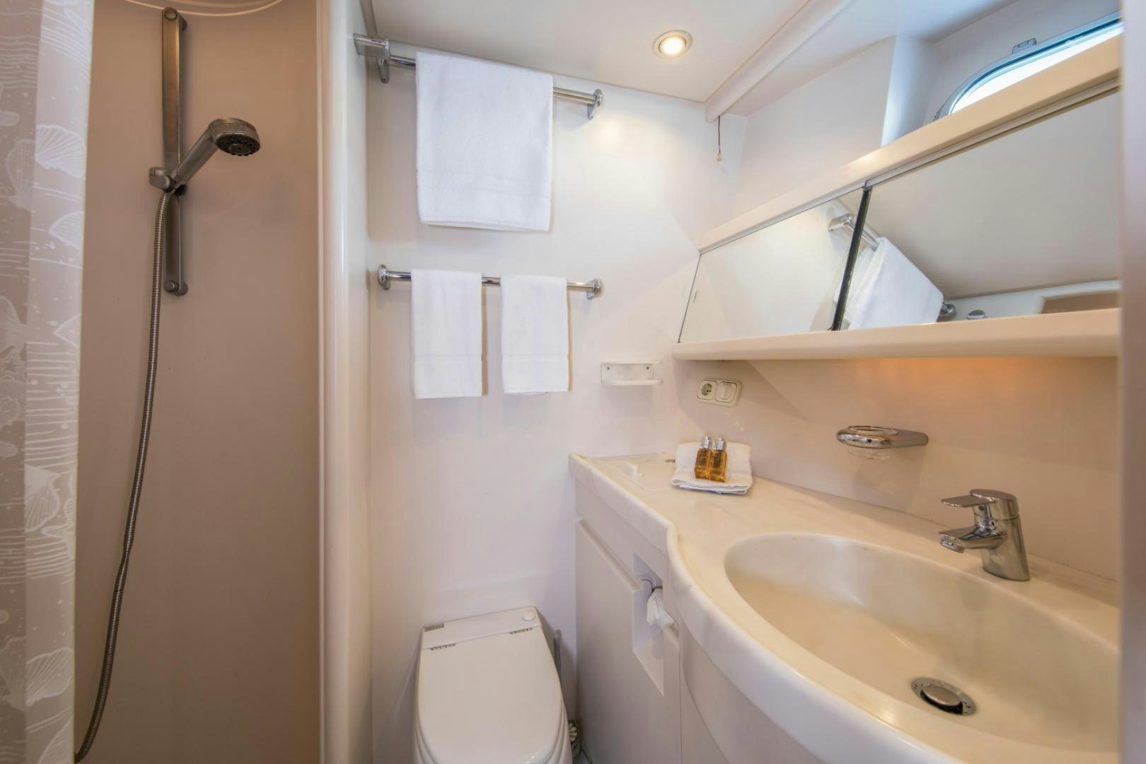 a bathroom with a sink and a toilet aboard ALTA MAREA Yacht for Sale