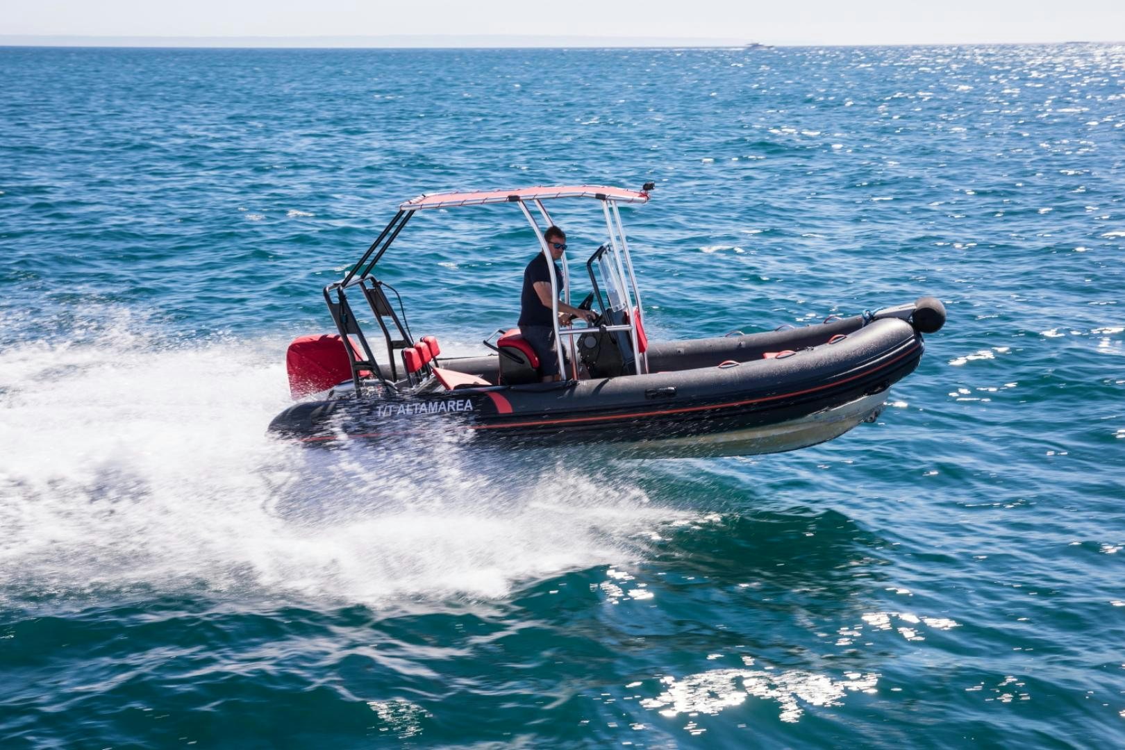 a person driving a boat aboard ALTA MAREA Yacht for Sale