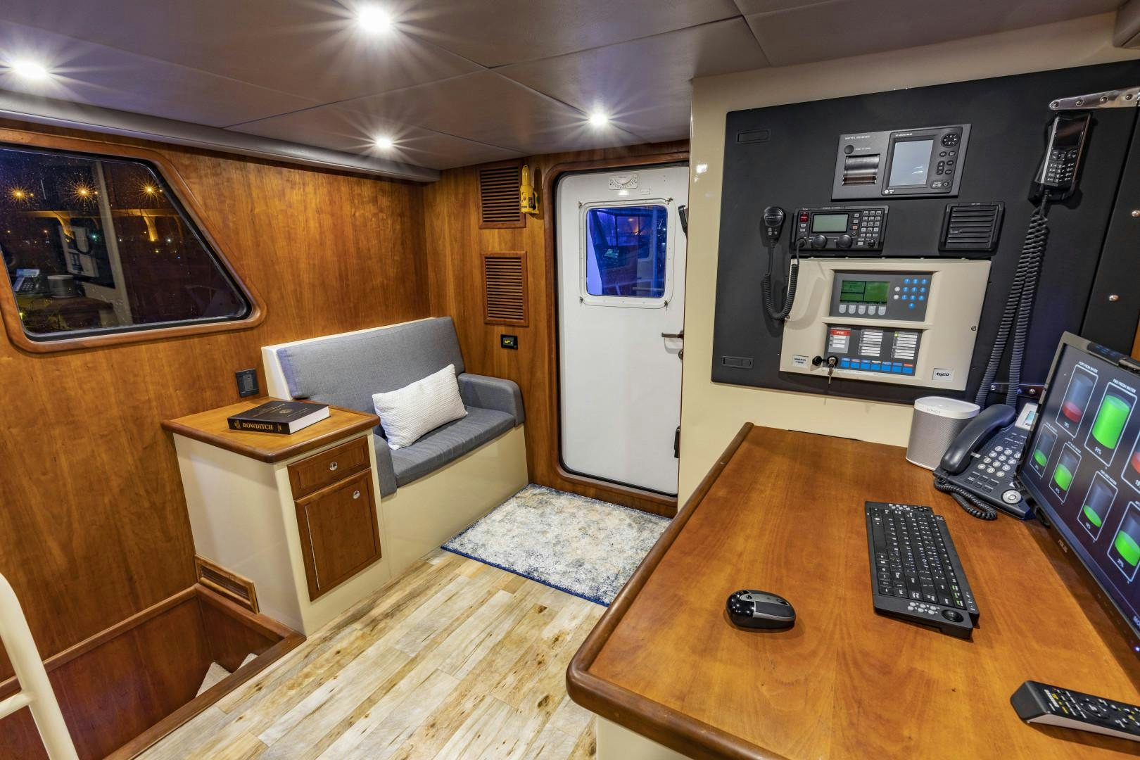 a room with a desk and computer aboard RESET Yacht for Sale