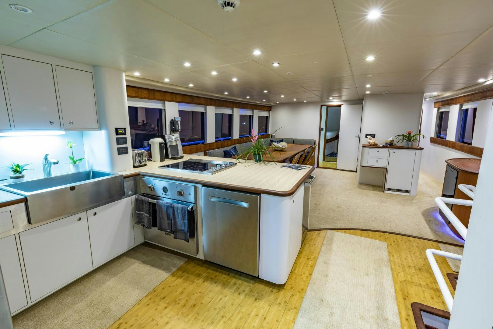 a kitchen with white cabinets aboard RESET Yacht for Sale