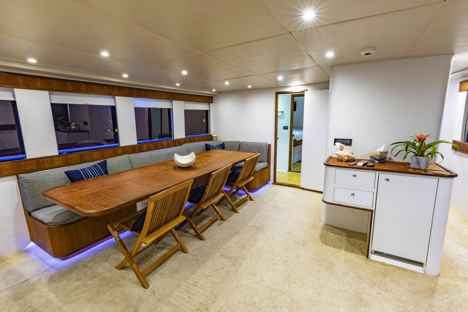 a large kitchen and dining area aboard RESET Yacht for Sale