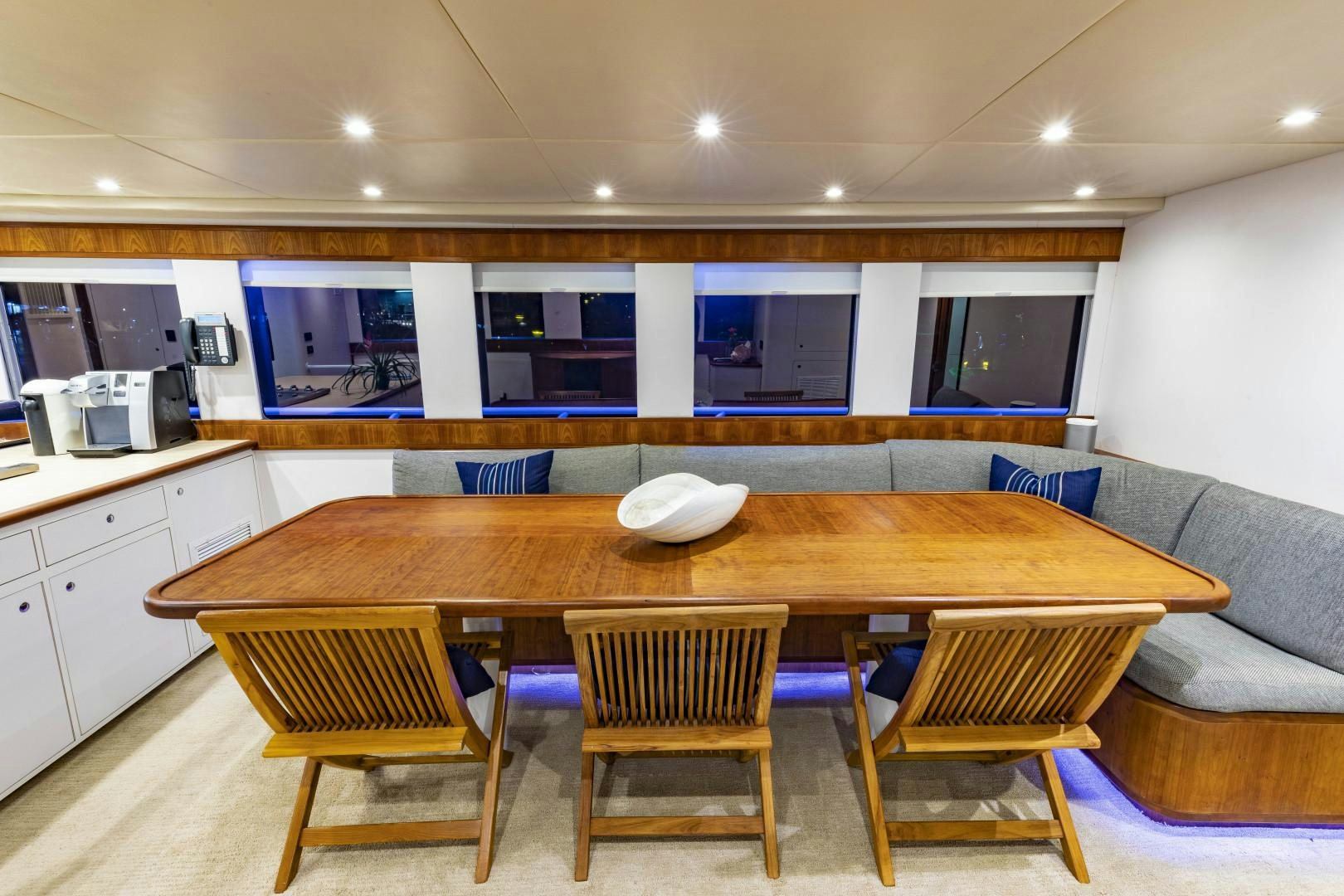 a kitchen and dining area aboard RESET Yacht for Sale