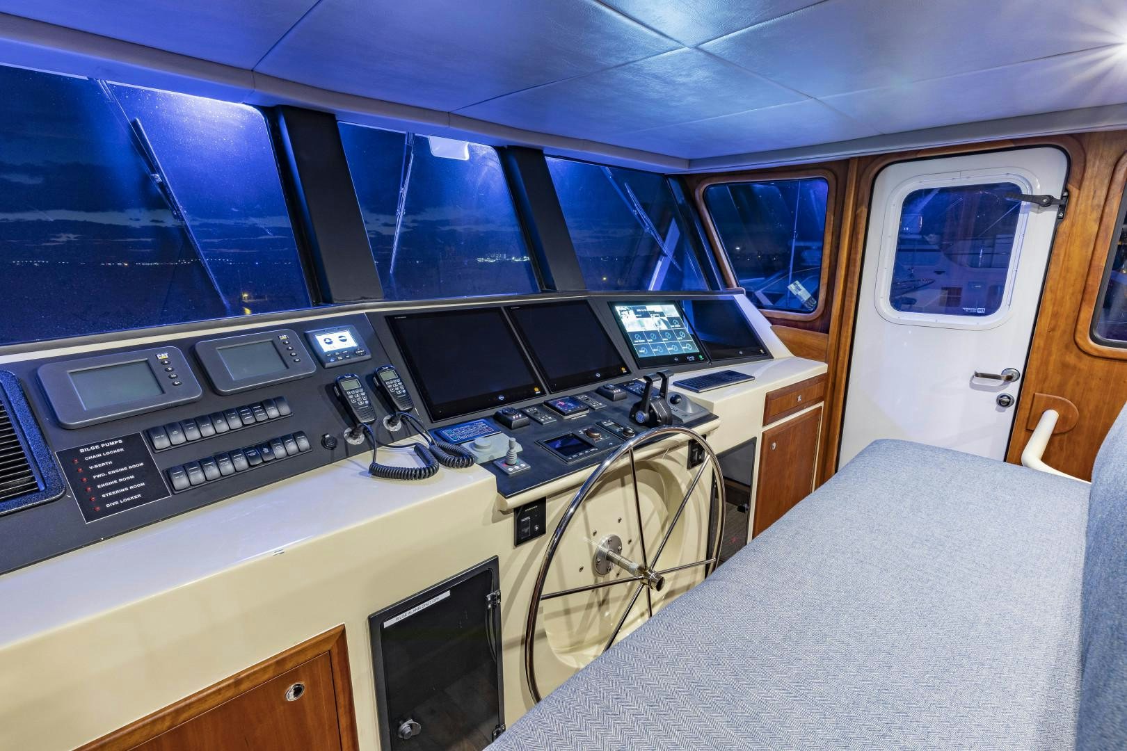 a room with a bed and computers aboard RESET Yacht for Sale