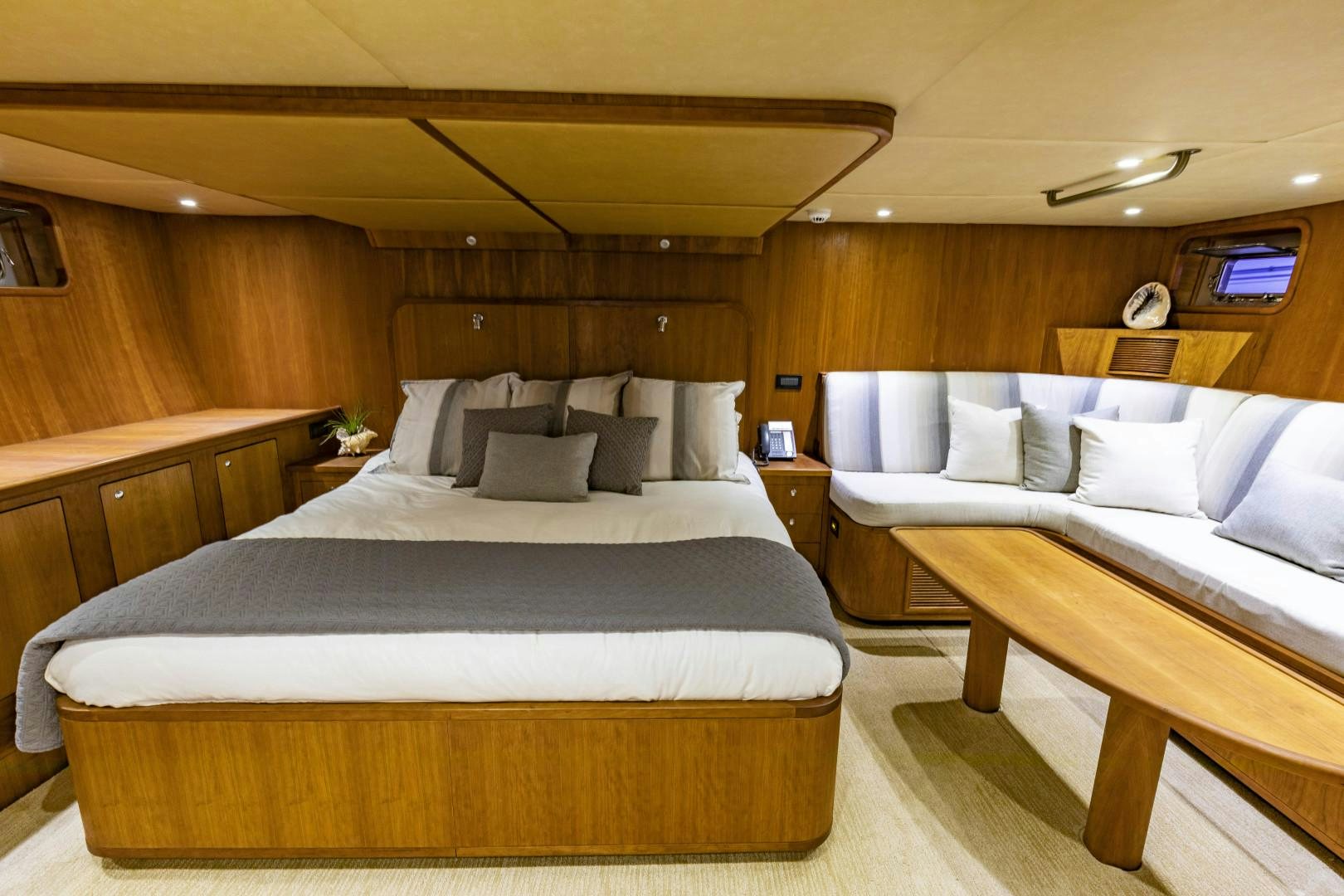 a room with a bed and a desk aboard RESET Yacht for Sale