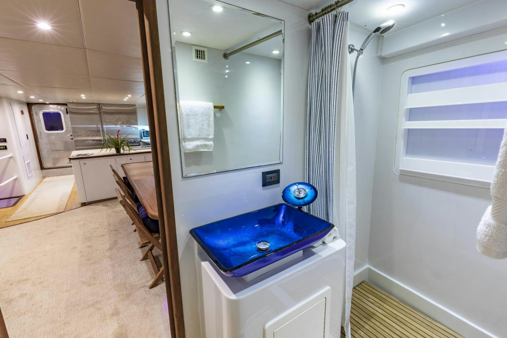 a bathroom with a sink and a mirror aboard RESET Yacht for Sale